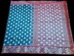 Close-up of a handwoven semi-silk Pochampally saree showing vibrant ikat diamond and temple motifs on a broad border