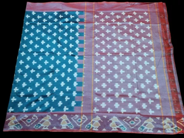 Close-up of a handwoven semi-silk Pochampally saree showing vibrant ikat diamond and temple motifs on a broad border