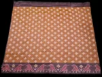 Close-up of a handwoven semi-silk Pochampally saree showing vibrant ikat diamond and temple motifs on a broad border