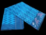 Close-up of a handwoven semi-silk Pochampally saree showing vibrant ikat diamond and temple motifs on a broad border