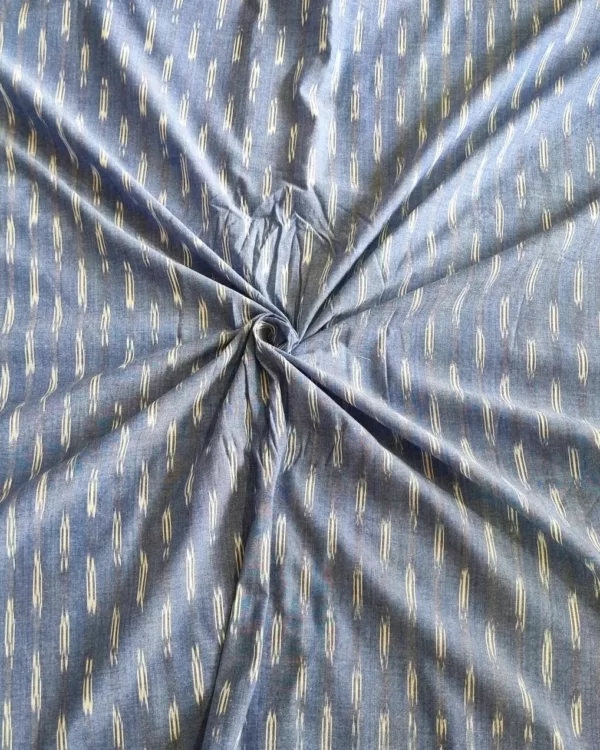 Handwoven ikat cotton fabric in vibrant tie-dye pattern