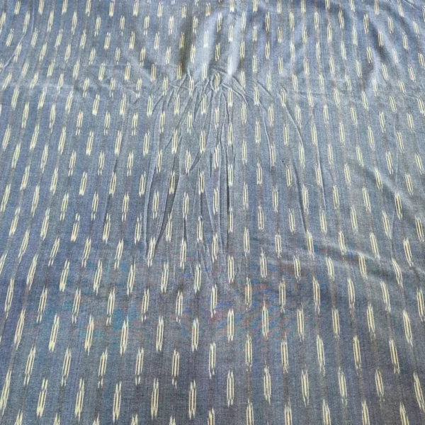 Handwoven ikat cotton fabric in vibrant tie-dye pattern