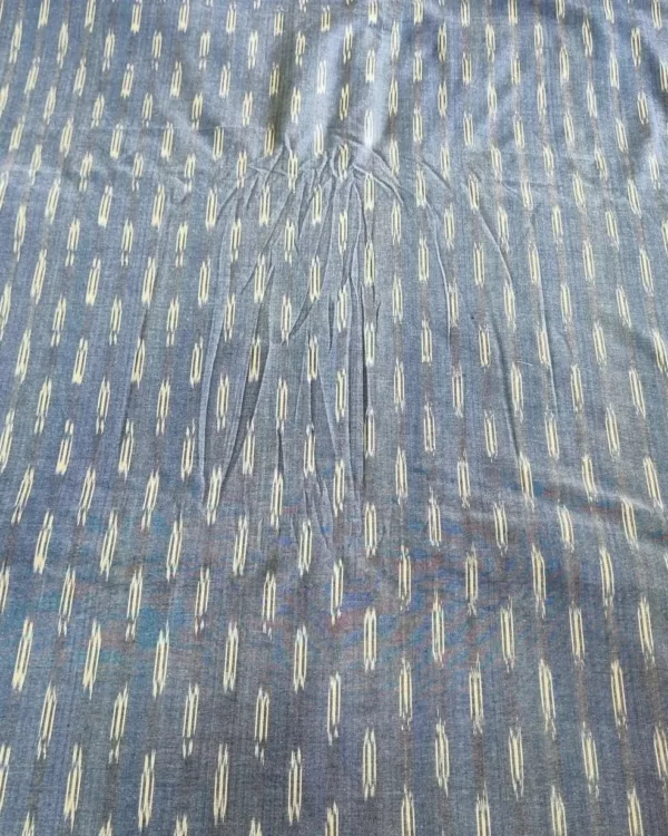 Handwoven ikat cotton fabric in vibrant tie-dye pattern