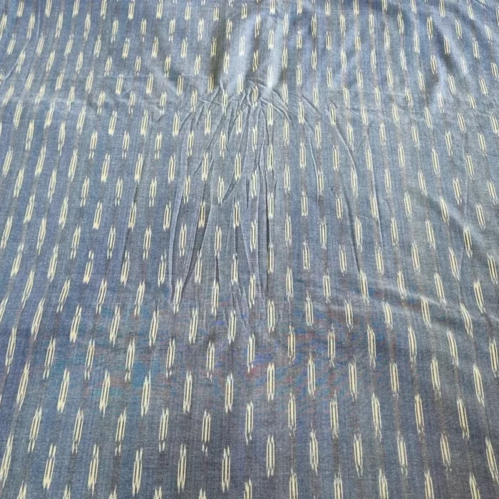 Handwoven ikat cotton fabric in vibrant tie-dye pattern