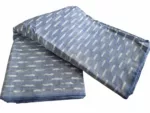 Handwoven ikat cotton fabric in vibrant tie-dye pattern