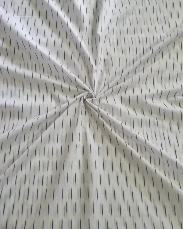 Soft breathable handloom cotton fabric ideal for stitching kurtas, dresses, and shirts – traditional Ikat pattern