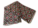 Shop premium handwoven Pochampally ikat fabric featuring a vibrant red, mustard, and white diamond pattern. Ideal for sarees, dupattas, kurtas, and home decor