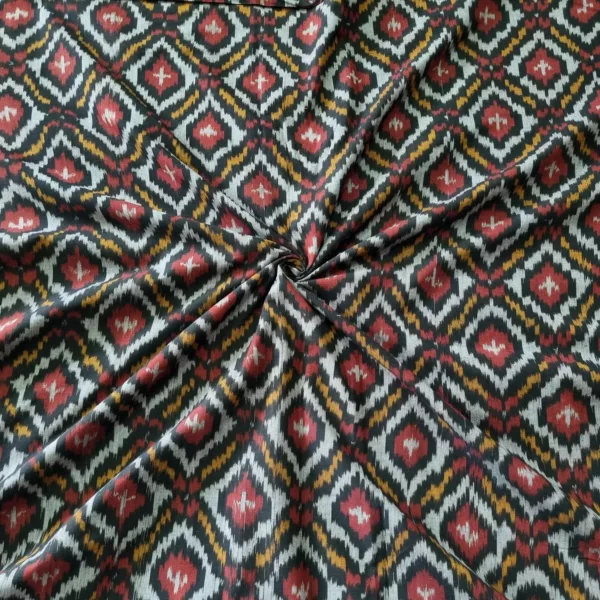 Shop premium handwoven Pochampally ikat fabric featuring a vibrant red, mustard, and white diamond pattern. Ideal for sarees, dupattas, kurtas, and home decor
