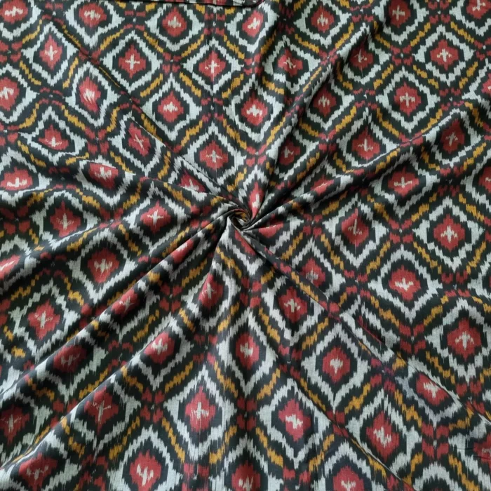 Shop premium handwoven Pochampally ikat fabric featuring a vibrant red, mustard, and white diamond pattern. Ideal for sarees, dupattas, kurtas, and home decor